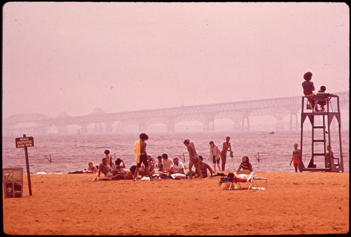 Beachgoers at Sandy Point State Park in June 1973, with the Chesapeake Bay Bridge in the background