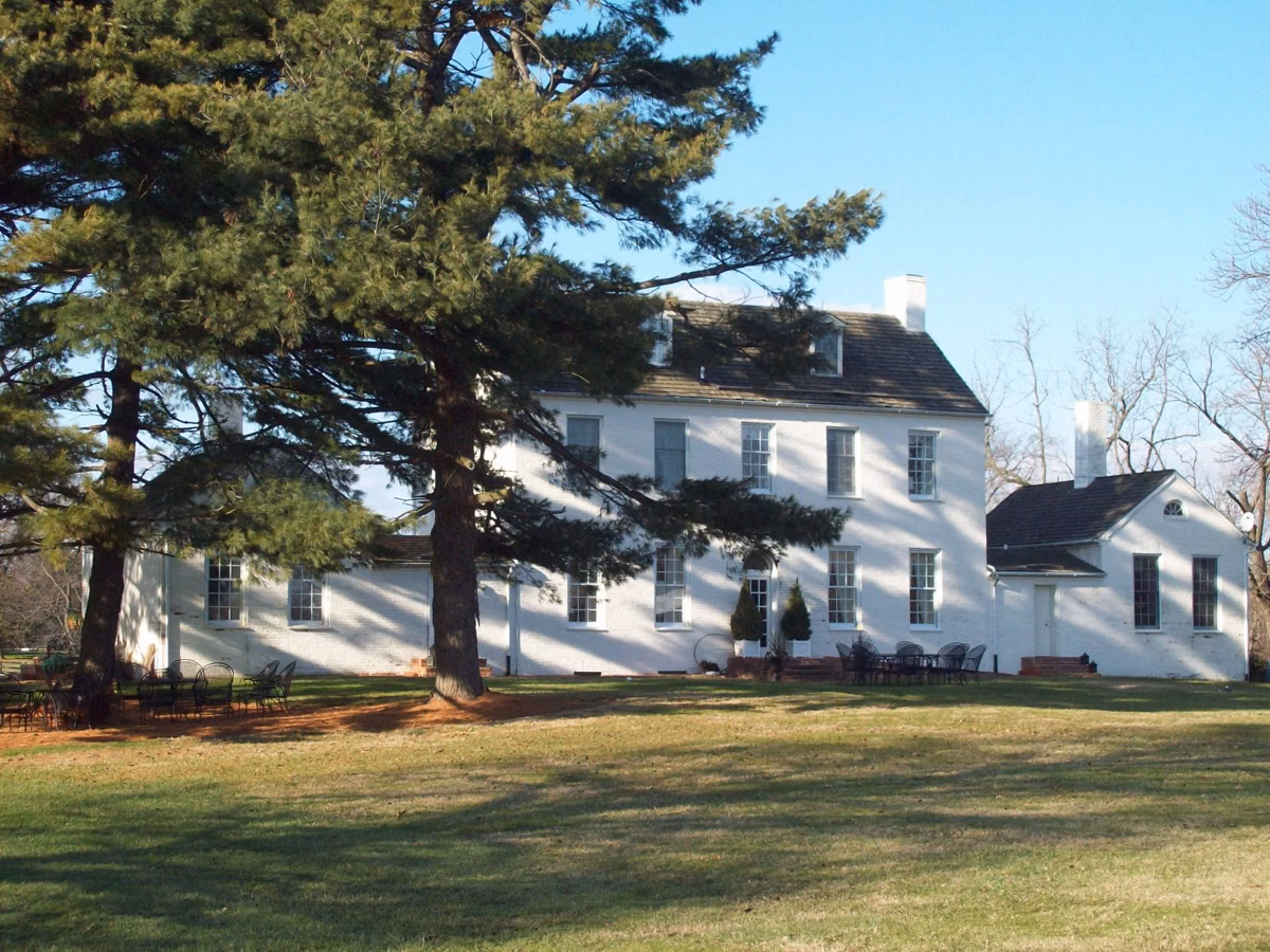 Rear view of the Sandy Point Mansion farmhouse in winter